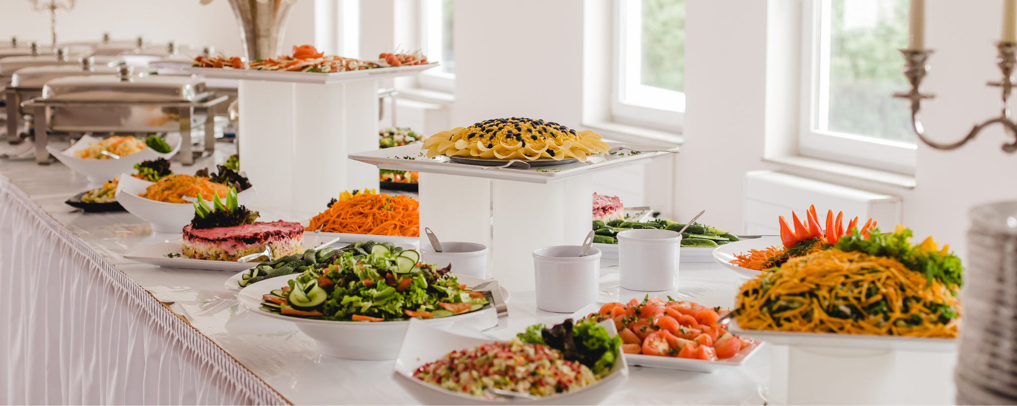 table with freshly made catered dishes